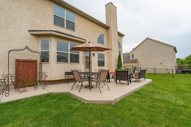 8738 Birch Brook Loop NW, Pickerington, OH 43147 - back of house with a patio area, stucco siding, and a chimney