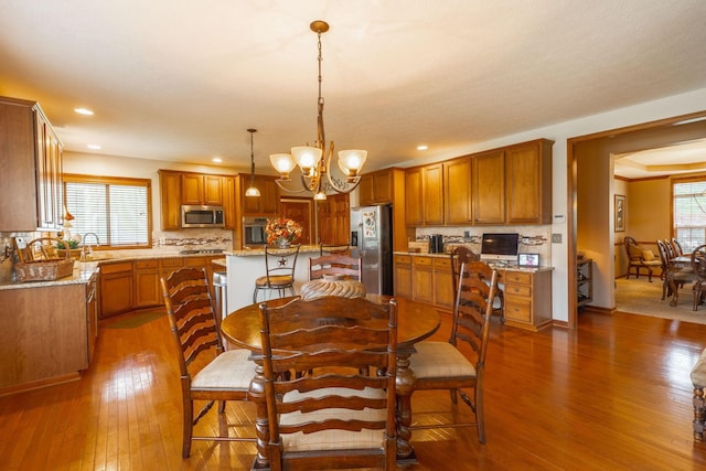 8738 Birch Brook Loop NW, Pickerington, OH 43147 - dining area featuring dark wood-style flooring, a chandelier, and recessed lighting