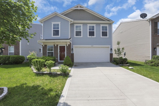 7429 Willow Leaf Dr, Canal Winchester, OH 43110 - craftsman inspired home with an attached garage, driveway, a front yard, and brick siding