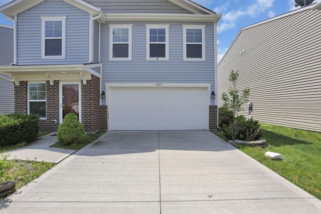 7429 Willow Leaf Dr, Canal Winchester, OH 43110 - traditional home with brick siding, driveway, and an attached garage