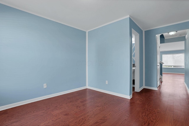 7429 Willow Leaf Dr, Canal Winchester, OH 43110 - empty room featuring crown molding, dark wood-type flooring, and baseboards
