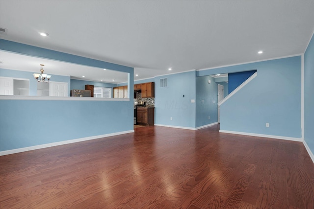 7429 Willow Leaf Dr, Canal Winchester, OH 43110 - unfurnished living room featuring a chandelier, dark wood-style floors, recessed lighting, and baseboards