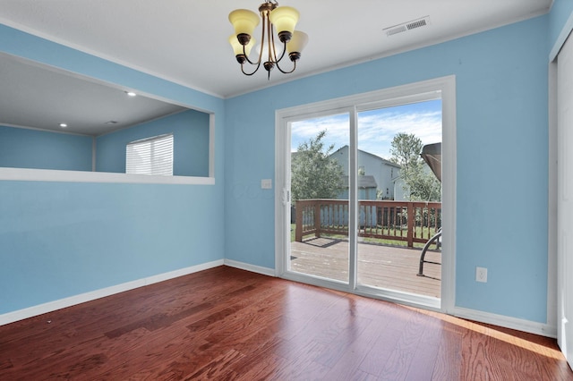 7429 Willow Leaf Dr, Canal Winchester, OH 43110 - unfurnished room with a chandelier, baseboards, healthy amount of natural light, and wood finished floors