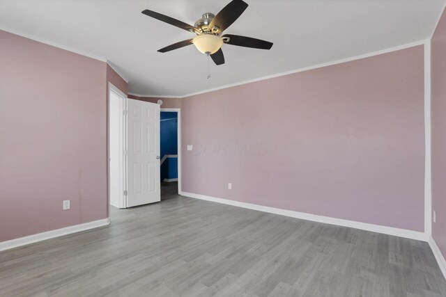 7429 Willow Leaf Dr, Canal Winchester, OH 43110 - empty room featuring baseboards, ceiling fan, wood finished floors, and crown molding