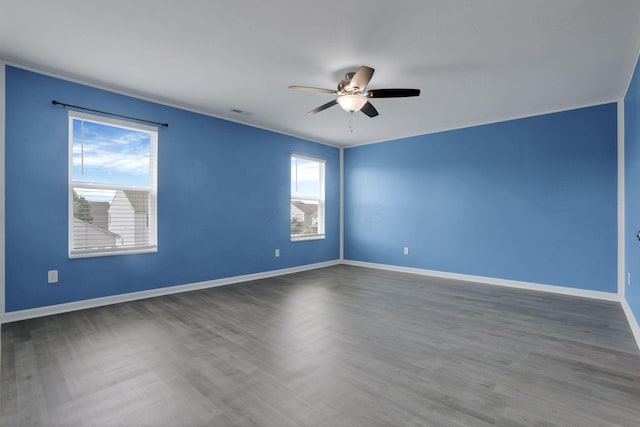 7429 Willow Leaf Dr, Canal Winchester, OH 43110 - empty room with healthy amount of natural light, ceiling fan, baseboards, and wood finished floors