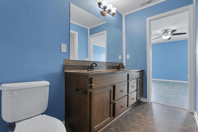 7429 Willow Leaf Dr, Canal Winchester, OH 43110 - bathroom featuring toilet, ceiling fan, double vanity, baseboards, and ornamental molding