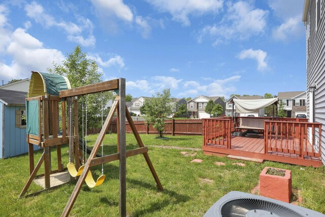 7429 Willow Leaf Dr, Canal Winchester, OH 43110 - view of yard with a residential view, cooling unit, a deck, and a playground