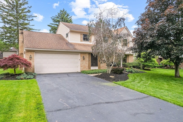 1009 Tall Tree Ct, Westerville, OH 43081 - traditional-style home featuring asphalt driveway, a front lawn, an attached garage, and brick siding