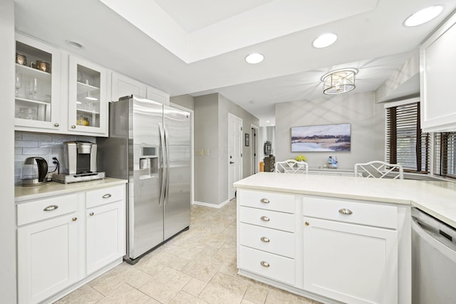 1009 Tall Tree Ct, Westerville, OH 43081 - kitchen featuring appliances with stainless steel finishes, white cabinets, tasteful backsplash, glass insert cabinets, and recessed lighting