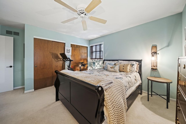 1009 Tall Tree Ct, Westerville, OH 43081 - bedroom featuring light colored carpet, two closets, ceiling fan, and baseboards
