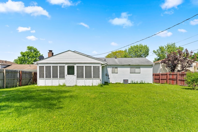 4818 Manitoba Rd, Columbus, OH 43229 - back of house featuring a sunroom, a chimney, and cooling unit