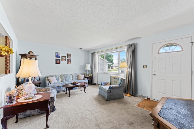 4818 Manitoba Rd, Columbus, OH 43229 - living room with light colored carpet and a textured ceiling