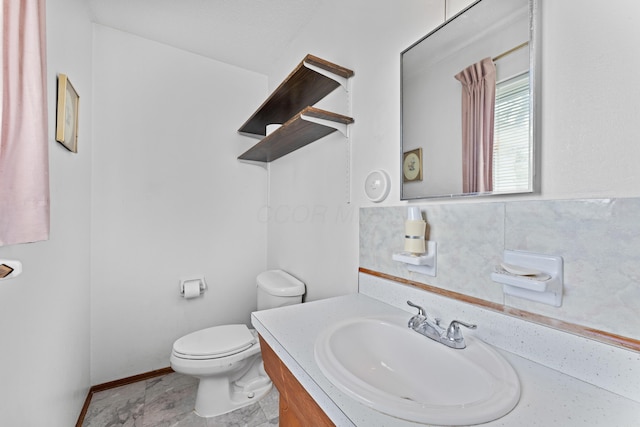 4818 Manitoba Rd, Columbus, OH 43229 - bathroom with toilet, vanity, and baseboards