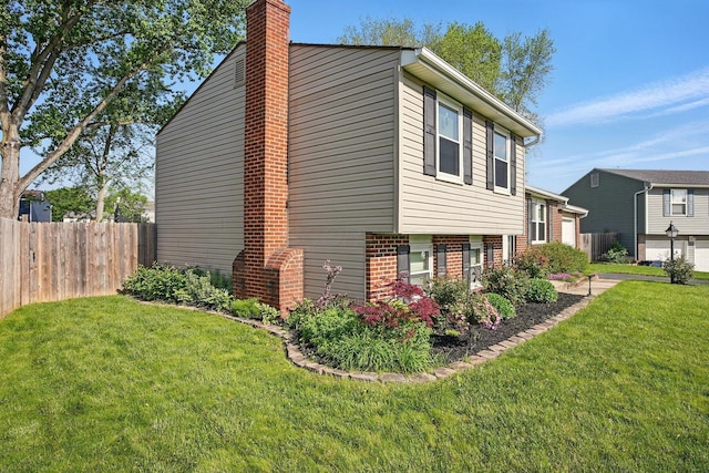 651 Dovalon Pl, Galloway, OH 43119 - view of home's exterior featuring a chimney and brick siding
