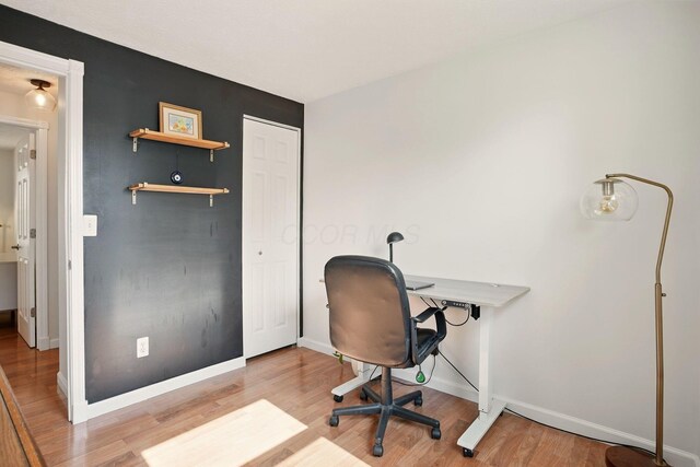 651 Dovalon Pl, Galloway, OH 43119 - office area featuring wood finished floors and baseboards