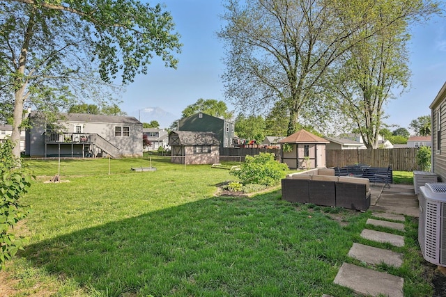 651 Dovalon Pl, Galloway, OH 43119 - view of yard featuring an outdoor hangout area, central AC, and stairway