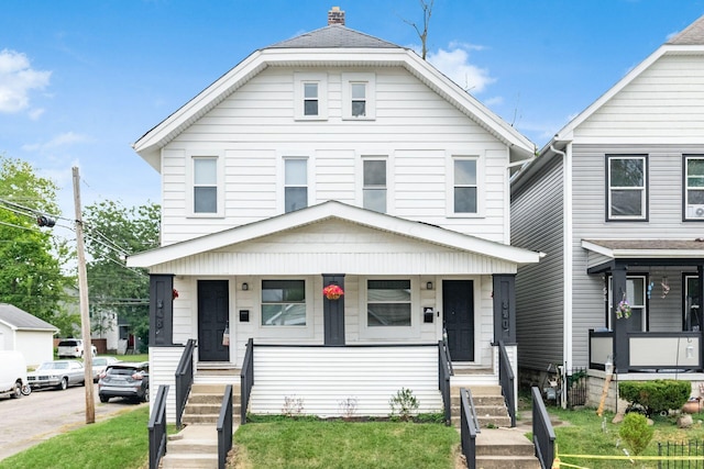 848-850 Carpenter St, Columbus, OH 43206 - american foursquare style home featuring covered porch and a front yard