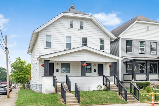 848-850 Carpenter St, Columbus, OH 43206 - view of front of property featuring a porch and a front lawn
