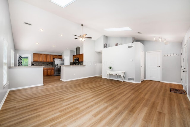 1472 Tall Meadows Dr, Columbus, OH 43223 - unfurnished living room featuring a skylight, a ceiling fan, baseboards, high vaulted ceiling, and recessed lighting