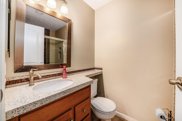 1472 Tall Meadows Dr, Columbus, OH 43223 - bathroom featuring a stall shower, vanity, and toilet