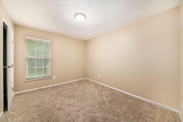 1472 Tall Meadows Dr, Columbus, OH 43223 - carpeted empty room with baseboards and a textured ceiling