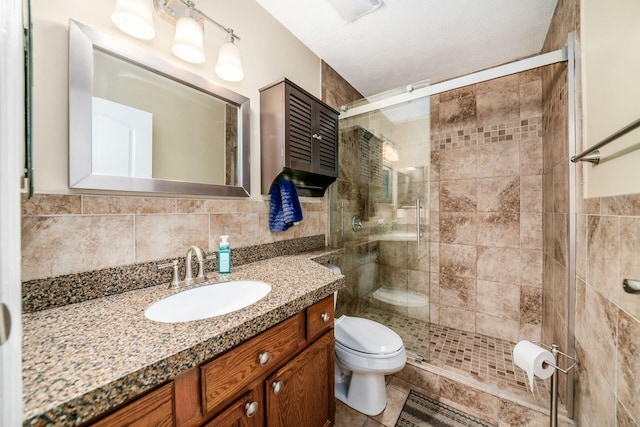 1472 Tall Meadows Dr, Columbus, OH 43223 - full bath with toilet, a stall shower, tile walls, vanity, and tile patterned flooring