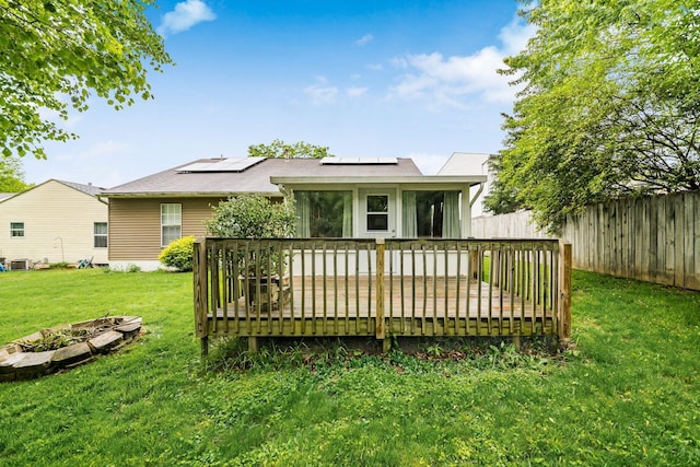 1472 Tall Meadows Dr, Columbus, OH 43223 - back of property featuring a deck, roof mounted solar panels, and cooling unit