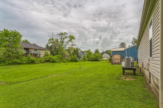 49 May Ave, Chauncey, OH 45719 - view of grassy yard featuring central AC unit