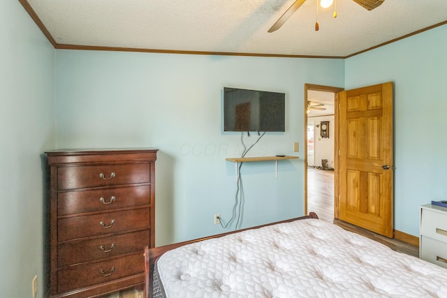 49 May Ave, Chauncey, OH 45719 - bedroom with ornamental molding, lofted ceiling, wood finished floors, a textured ceiling, and a ceiling fan