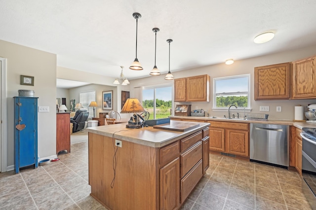 15301 Gandy Eddy Rd, Marysville, OH 43040 - kitchen featuring appliances with stainless steel finishes, a sink, a center island, light countertops, and hanging light fixtures