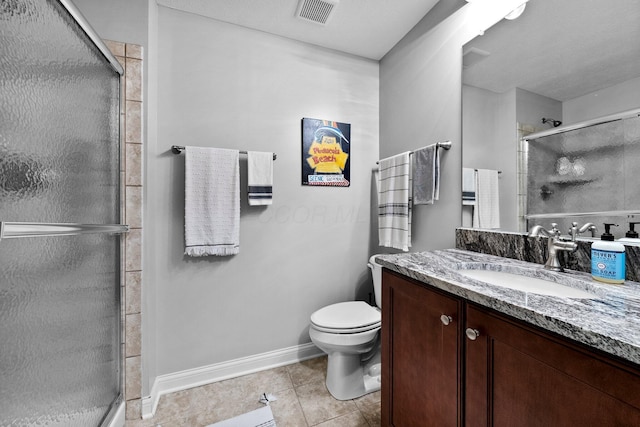 5568 Lexington Dr, Hilliard, OH 43026 - bathroom with a shower stall, toilet, tile patterned flooring, vanity, and baseboards