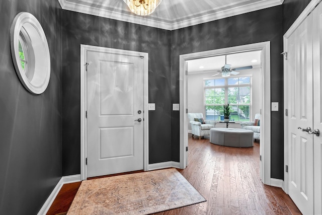 5568 Lexington Dr, Hilliard, OH 43026 - foyer with ornamental molding, dark wood-style flooring, and baseboards