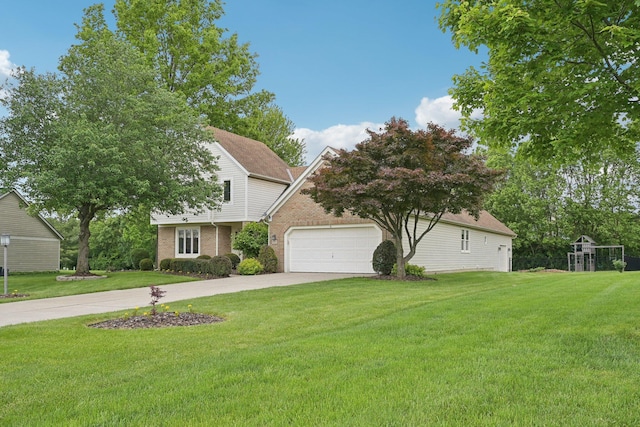 8628 N Spring Ct, Pickerington, OH 43147 - view of front of house featuring a garage, brick siding, a front yard, and driveway