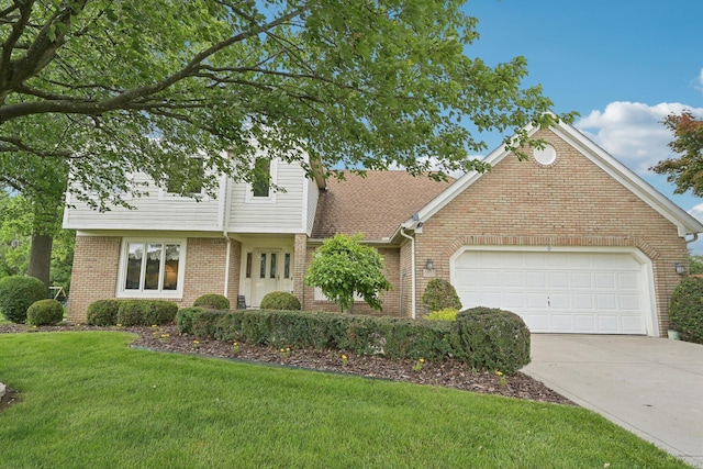 8628 N Spring Ct, Pickerington, OH 43147 - view of front facade with brick siding, concrete driveway, a front yard, and a garage