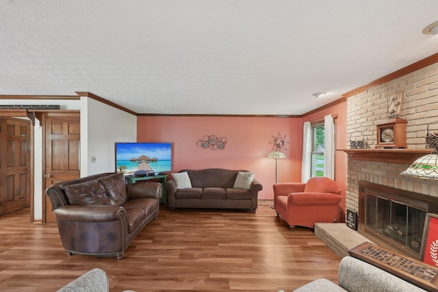 8628 N Spring Ct, Pickerington, OH 43147 - living area with ornamental molding, wood finished floors, and a fireplace