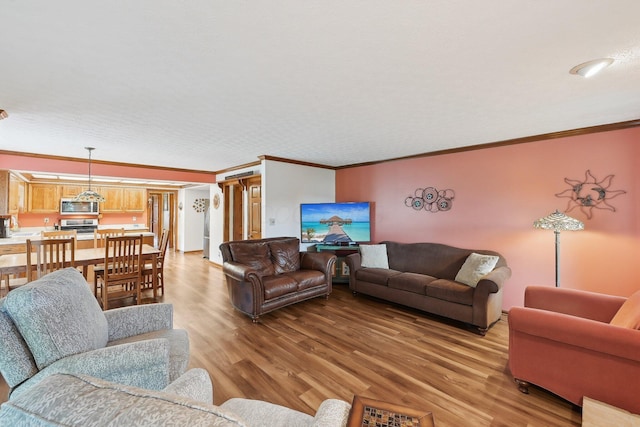 8628 N Spring Ct, Pickerington, OH 43147 - living area with light wood-style flooring and ornamental molding
