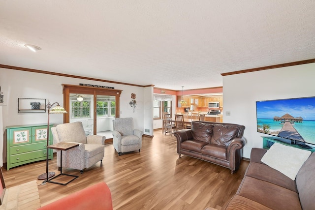 8628 N Spring Ct, Pickerington, OH 43147 - living area with light wood-style flooring, crown molding, and baseboards