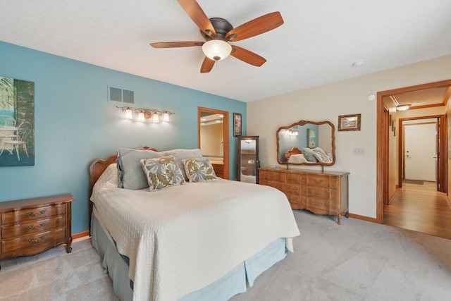 8628 N Spring Ct, Pickerington, OH 43147 - bedroom with light colored carpet, a ceiling fan, ensuite bathroom, and baseboards
