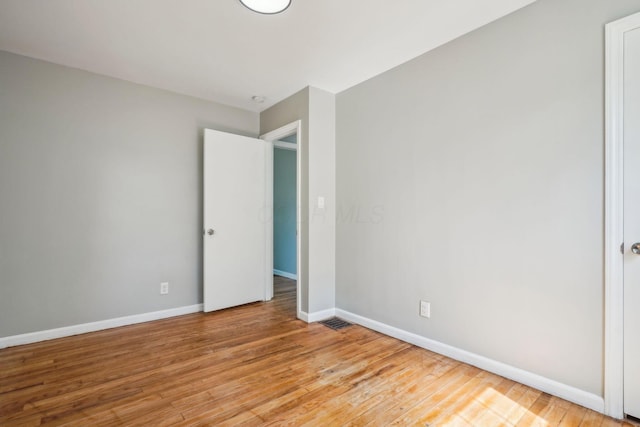 1118 E 26th Ave, Columbus, OH 43211 - unfurnished bedroom featuring light wood-style floors and baseboards
