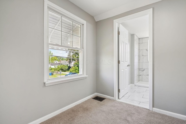 1118 E 26th Ave, Columbus, OH 43211 - unfurnished bedroom featuring baseboards, carpet, and ensuite bathroom