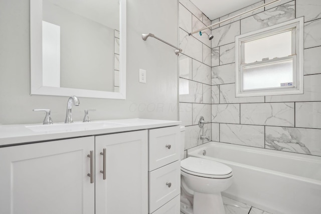 1118 E 26th Ave, Columbus, OH 43211 - bathroom featuring vanity, toilet, marble finish floors, and shower / bathtub combination