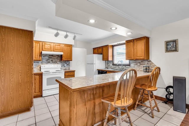 3350 Cameron St, Grove City, OH 43123 - kitchen featuring white appliances, a peninsula, a breakfast bar, crown molding, and brown cabinetry
