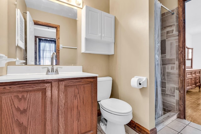 3350 Cameron St, Grove City, OH 43123 - bathroom featuring toilet, vanity, a stall shower, tile patterned floors, and baseboards