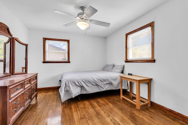 3350 Cameron St, Grove City, OH 43123 - bedroom featuring multiple windows, wood finished floors, baseboards, and a ceiling fan