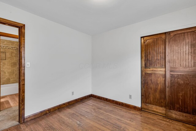 3350 Cameron St, Grove City, OH 43123 - unfurnished bedroom featuring wood finished floors, baseboards, and a closet