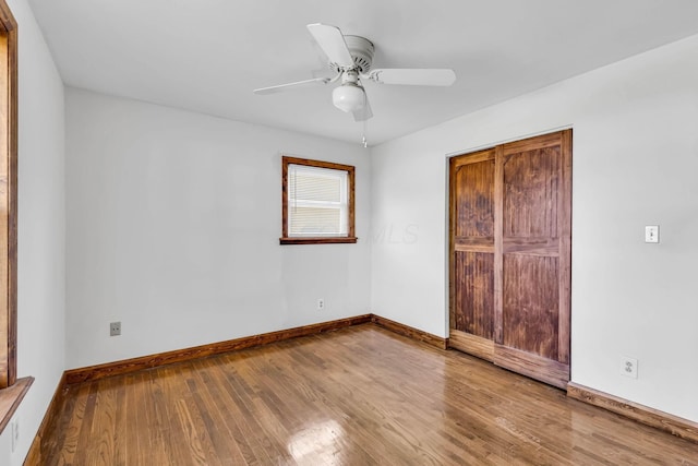 3350 Cameron St, Grove City, OH 43123 - unfurnished bedroom with wood finished floors, baseboards, a ceiling fan, and a closet