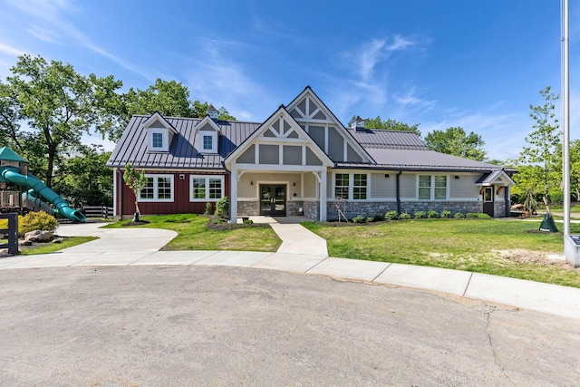 3350 Cameron St, Grove City, OH 43123 - view of front of house with french doors, a front yard, stone siding, and a playground