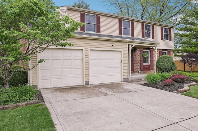 8177 Maugham Dr, Reynoldsburg, OH 43068 - traditional-style house with concrete driveway, an attached garage, and brick siding
