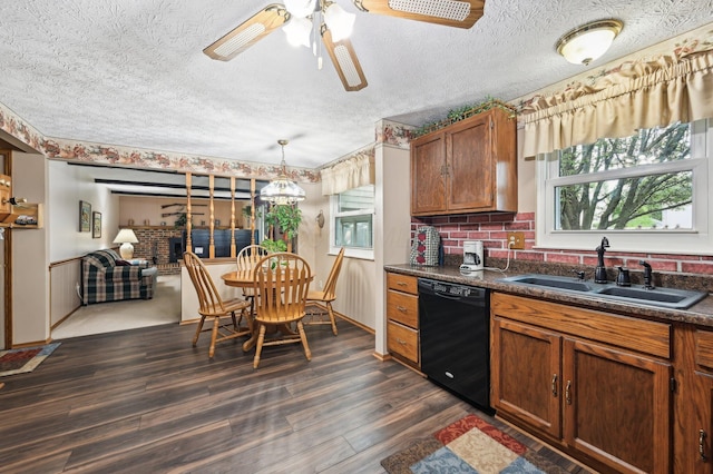 8177 Maugham Dr, Reynoldsburg, OH 43068 - kitchen with dishwasher, a sink, dark countertops, a ceiling fan, and dark wood-style floors
