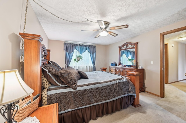8177 Maugham Dr, Reynoldsburg, OH 43068 - bedroom featuring light carpet, a textured ceiling, a ceiling fan, and baseboards